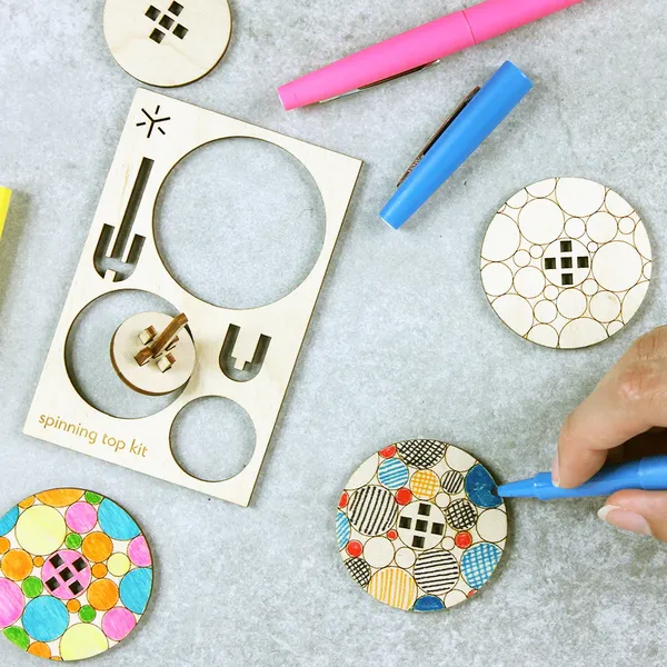 Bright Beam Goods: Geometric Spinning Tops